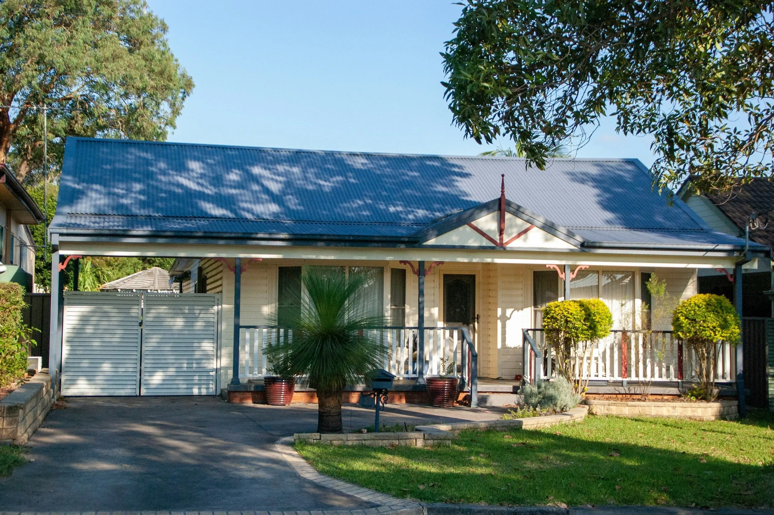 Single storey house with a front verandah and driveway in daylight